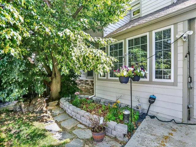 a front view of a house having fountain