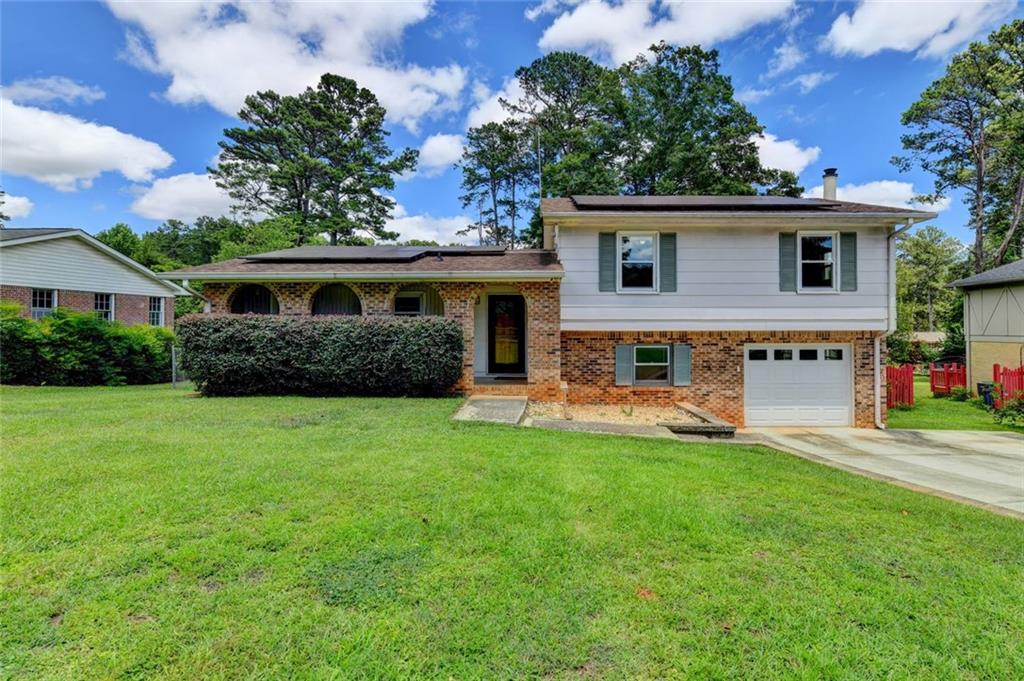 1577 Harbour Oaks Road Tucker, GA 30084 - Photo 2 of 58 front view of a house with a yard