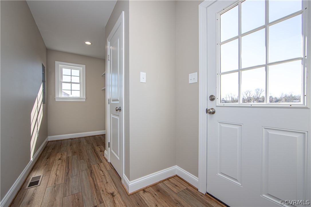 360 Vogel Road Cumberland, VA 23040 - Photo 13 of 25 an empty room with wooden floor and windows