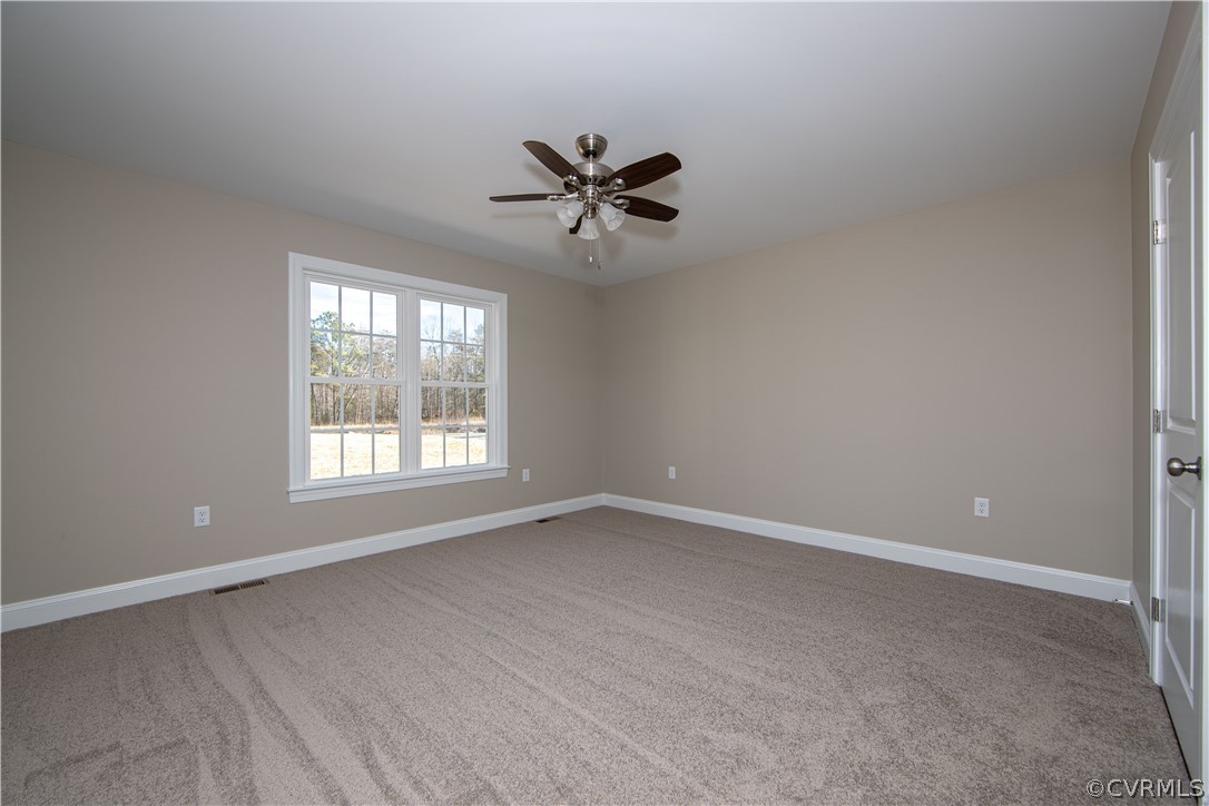 360 Vogel Road Cumberland, VA 23040 - Photo 15 of 25 an empty room with windows and fan