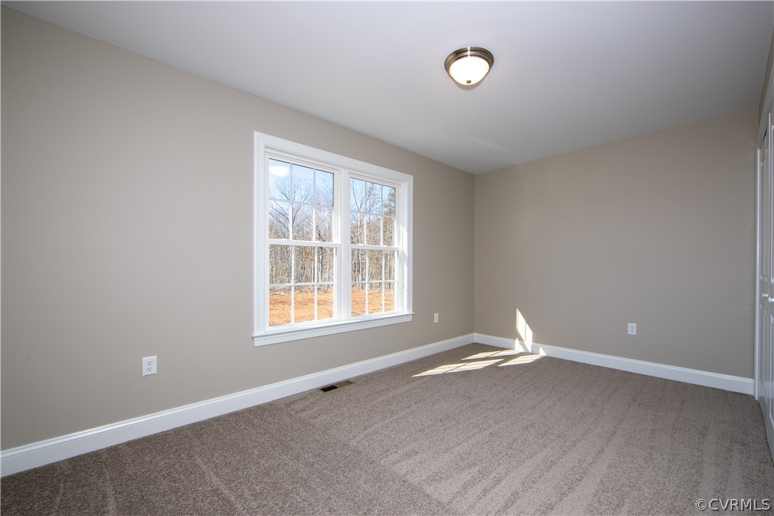 360 Vogel Road Cumberland, VA 23040 - Photo 23 of 25 an empty room with wooden floor and windows
