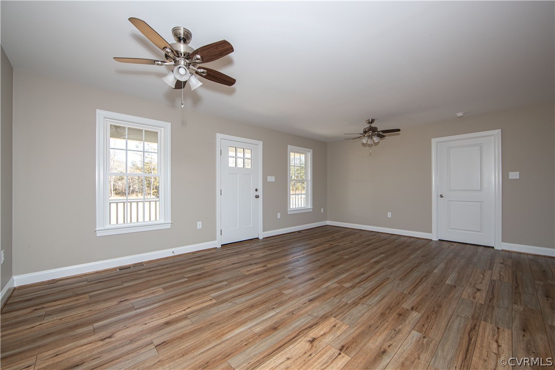 360 Vogel Road Cumberland, VA 23040 - Photo 6 of 25 a view of an empty room with wooden floor and a window