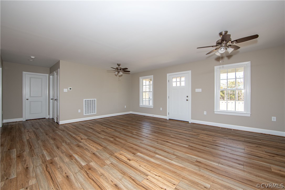 360 Vogel Road Cumberland, VA 23040 - Photo 7 of 25 a view of empty room with wooden floor and fan