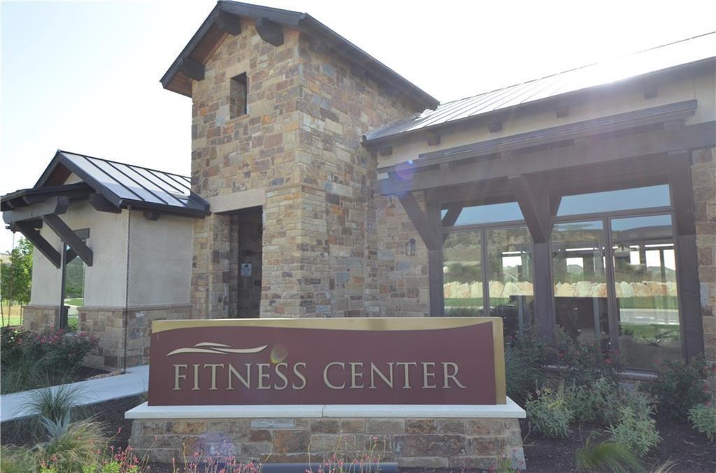 5629 Rio Chama Cove Austin, TX 78738 - Photo 32 of 34 A stone-clad fitness center beckons with its inviting entrance and ample natural light.