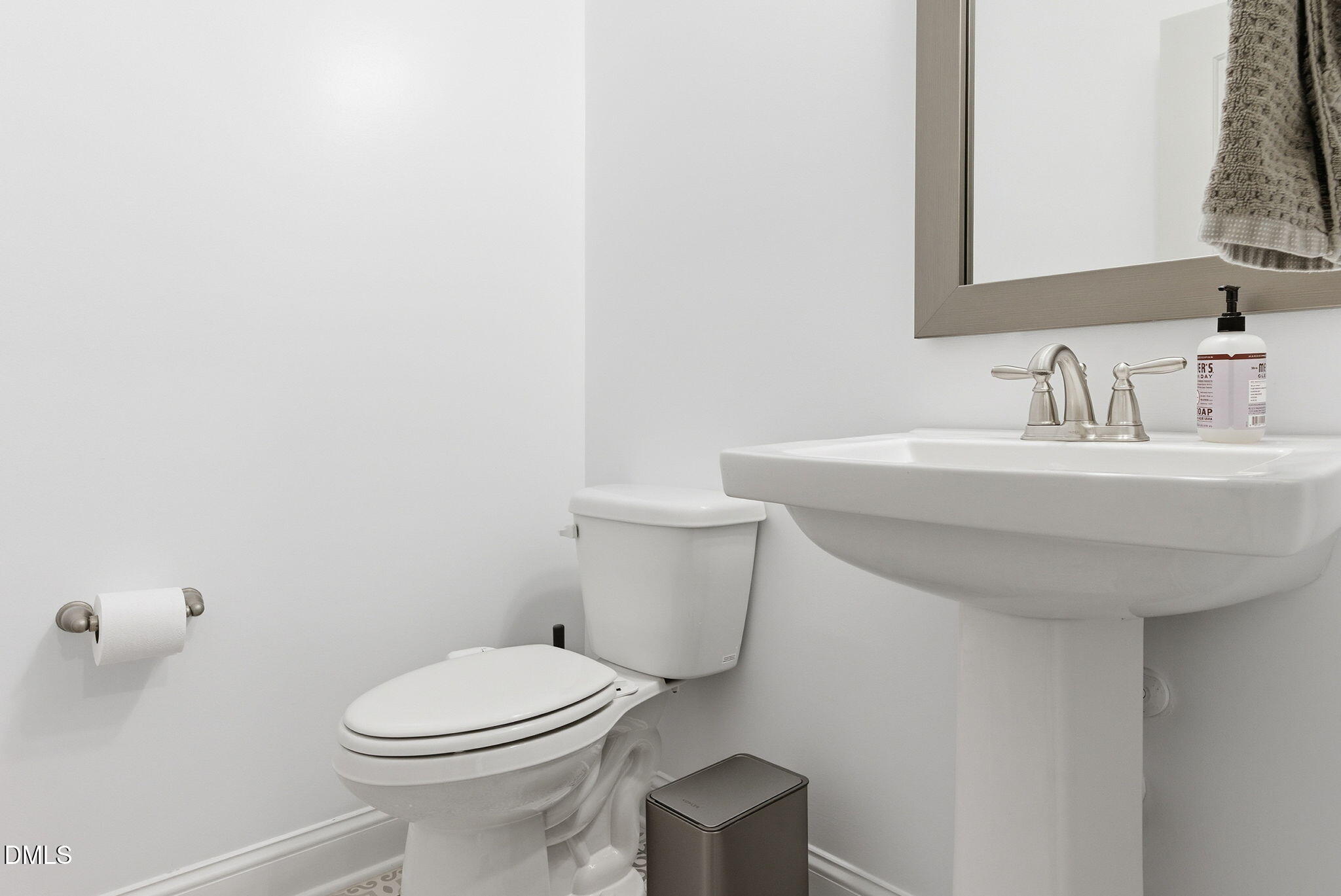 513 Ingram Ridge Court Knightdale, NC 27545 - Photo 17 of 74 a bathroom with a sink a toilet and mirror