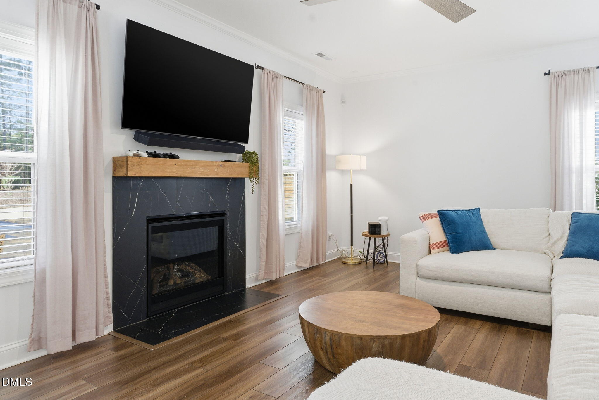 513 Ingram Ridge Court Knightdale, NC 27545 - Photo 29 of 74 a living room with furniture and a flat screen tv