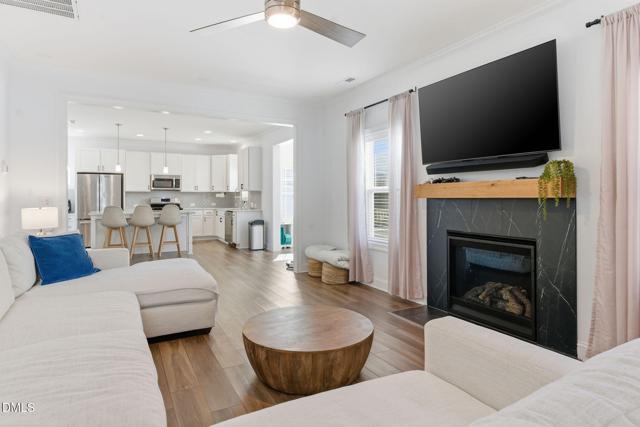 513 Ingram Ridge Court Knightdale, NC 27545 - Photo 31 of 74 a living room with furniture and a flat screen tv