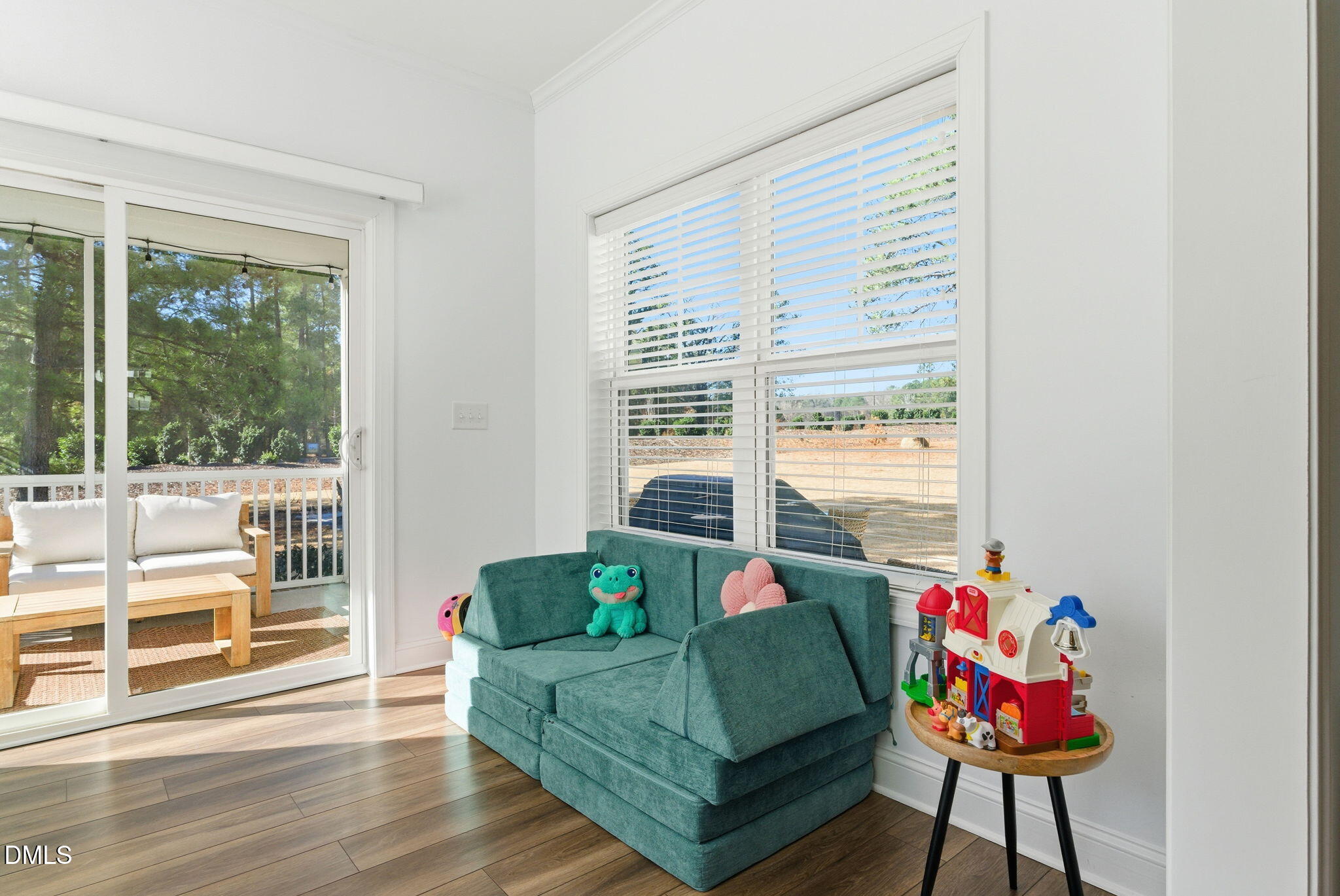 513 Ingram Ridge Court Knightdale, NC 27545 - Photo 34 of 74 a living room with furniture and a floor to ceiling window
