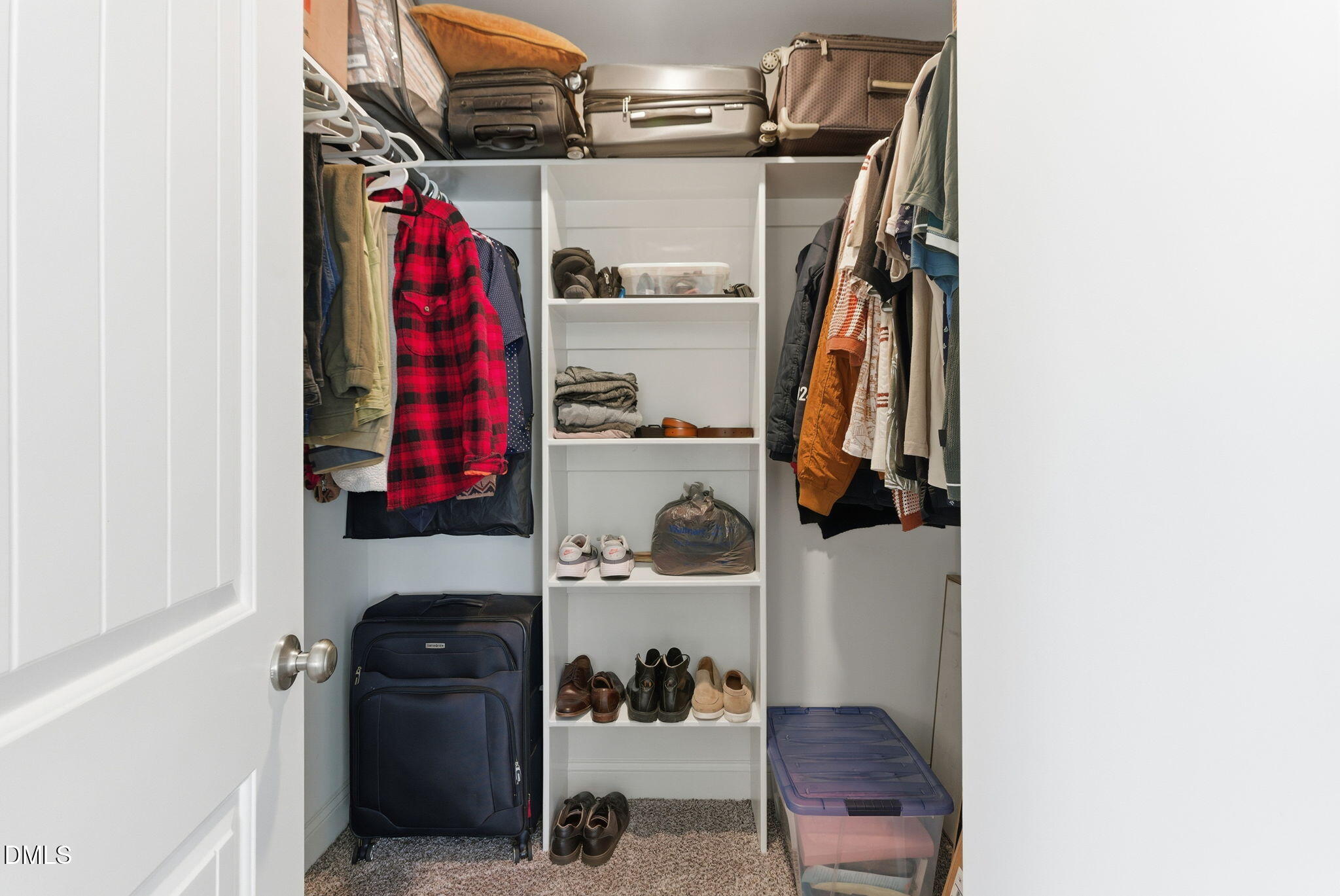513 Ingram Ridge Court Knightdale, NC 27545 - Photo 44 of 74 a view of walk in closet with clothes and shoes