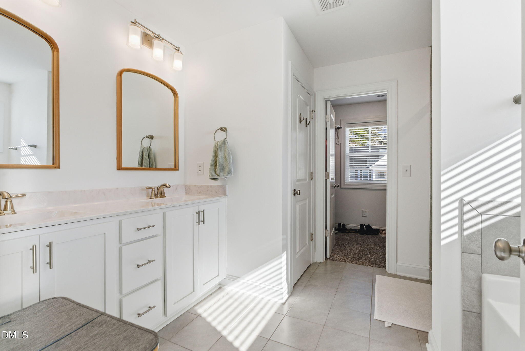513 Ingram Ridge Court Knightdale, NC 27545 - Photo 45 of 74 a bathroom with a double vanity sink and mirror