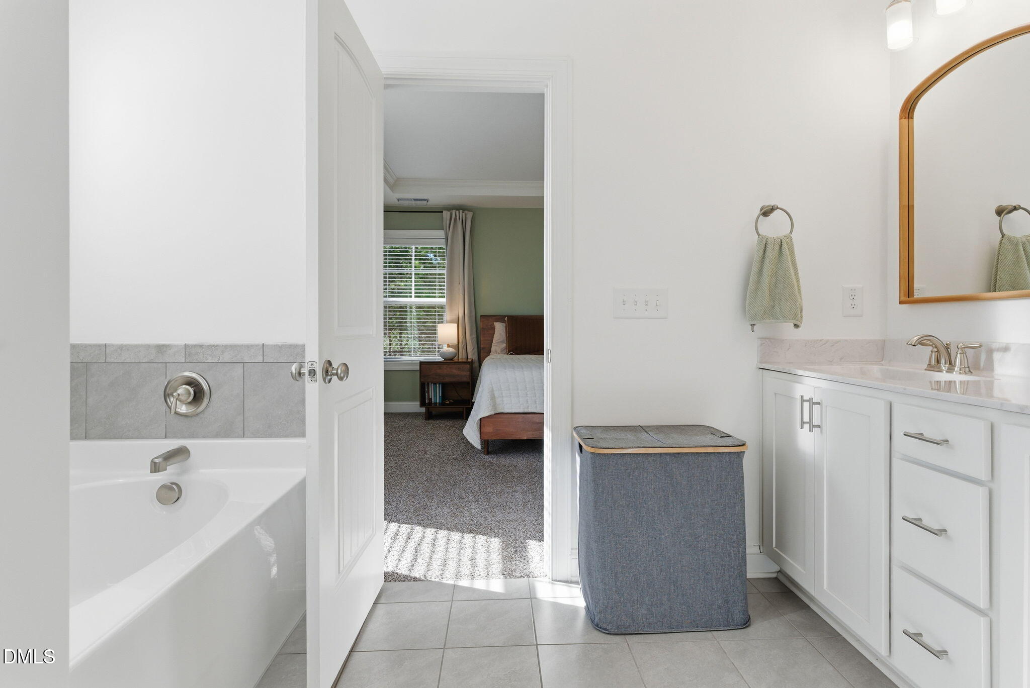 513 Ingram Ridge Court Knightdale, NC 27545 - Photo 48 of 74 a en suite bathroom with a sink a tub and mirror