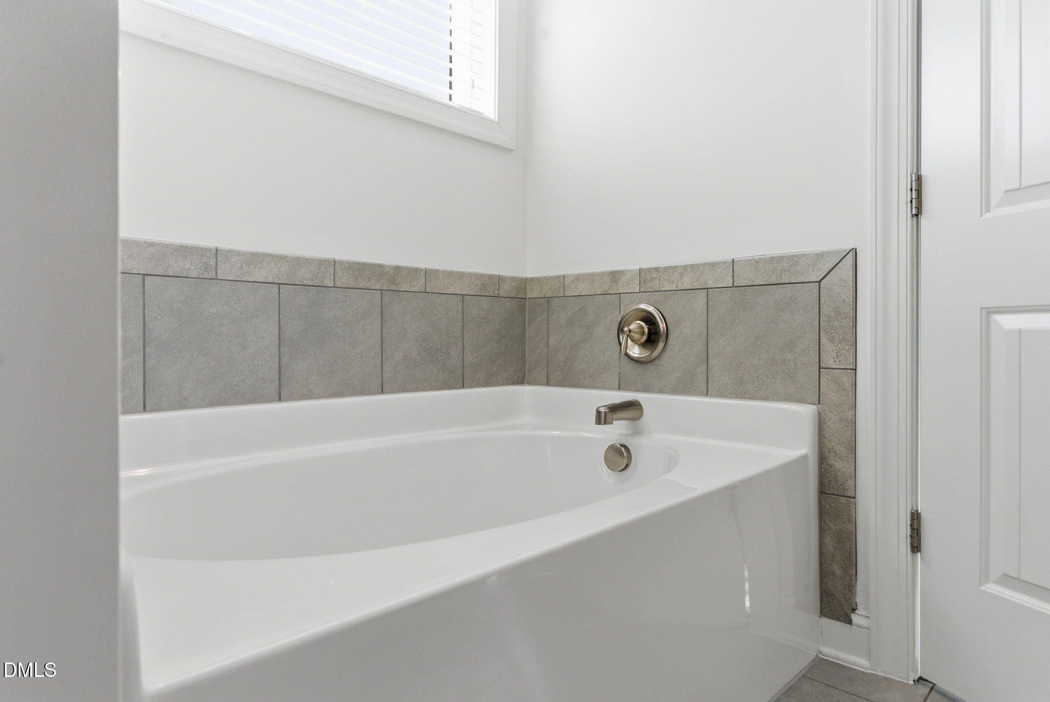 513 Ingram Ridge Court Knightdale, NC 27545 - Photo 49 of 74 a bathroom with a bathtub