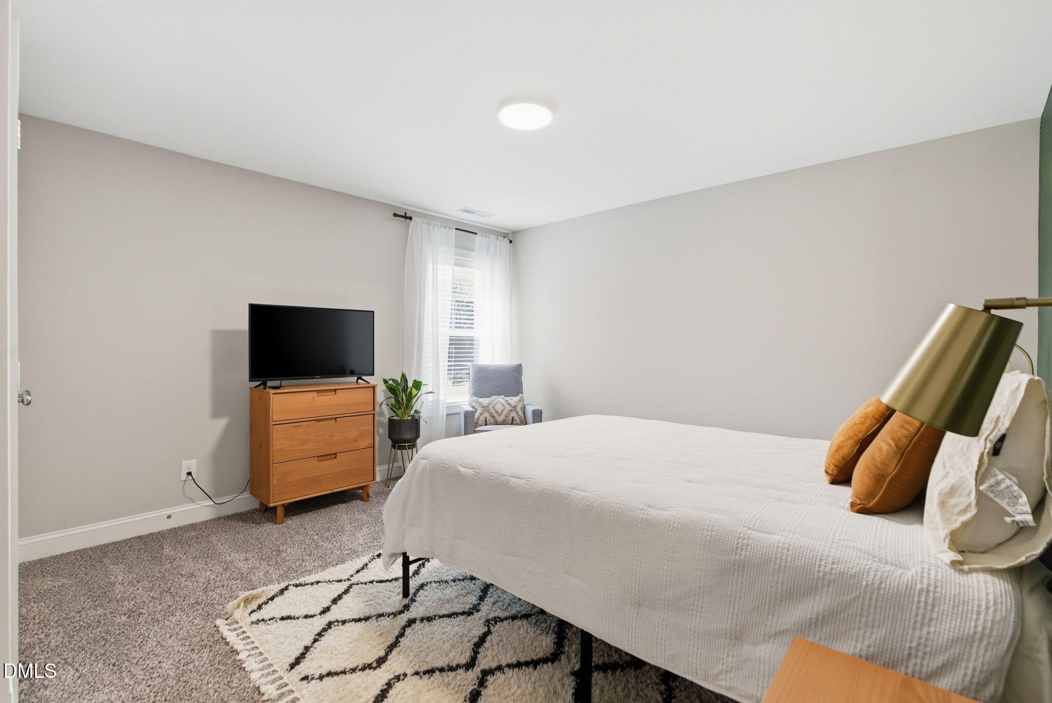 513 Ingram Ridge Court Knightdale, NC 27545 - Photo 58 of 74 a bedroom with a bed and flat screen tv