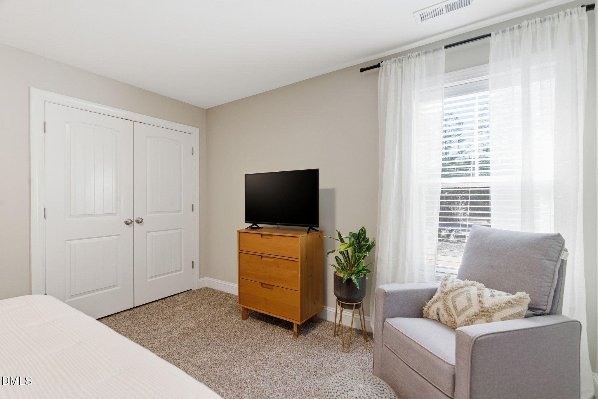 513 Ingram Ridge Court Knightdale, NC 27545 - Photo 59 of 74 a living room with furniture and a flat screen tv