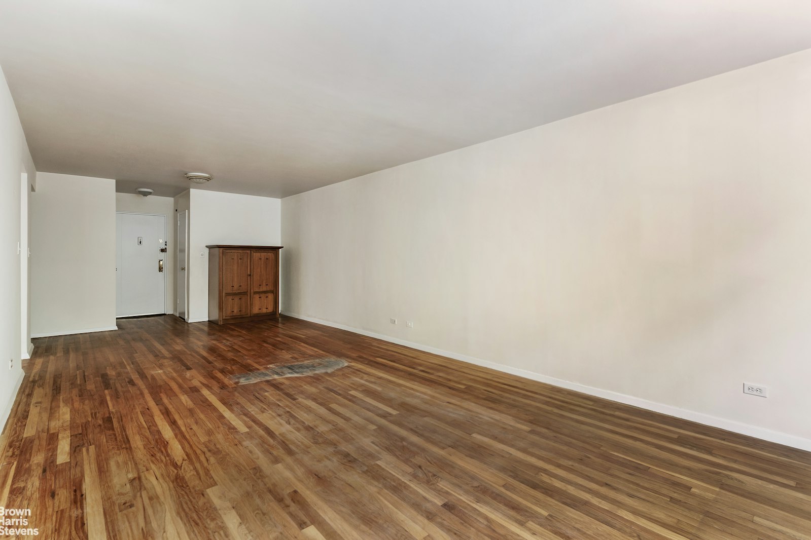 525 West 236th Street, Unit 2D Bronx, NY 10463 - Photo 3 of 9 a view of empty room with wooden floor and windows