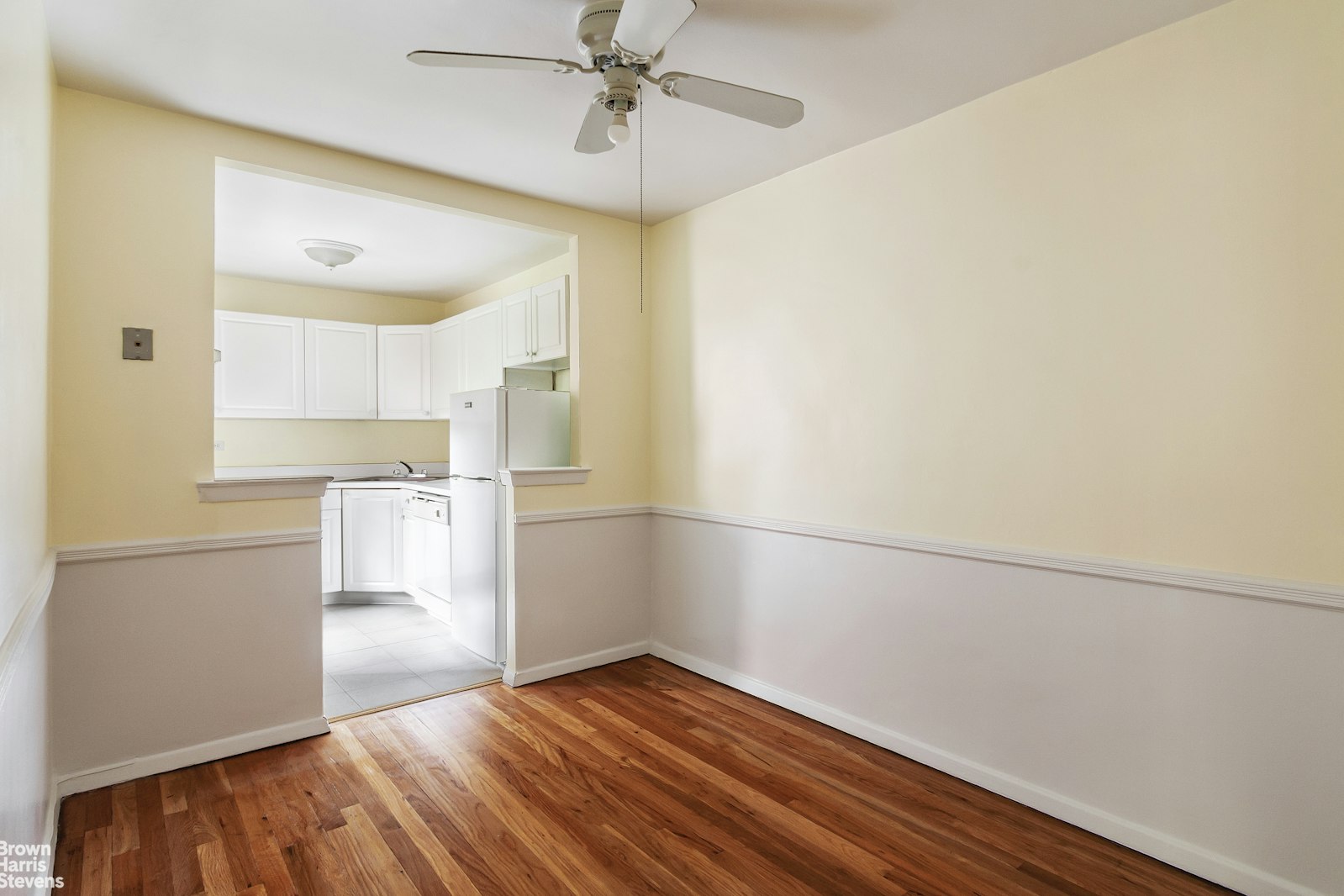 525 West 236th Street, Unit 2D Bronx, NY 10463 - Photo 4 of 9 a view of empty room with wooden floor and fan