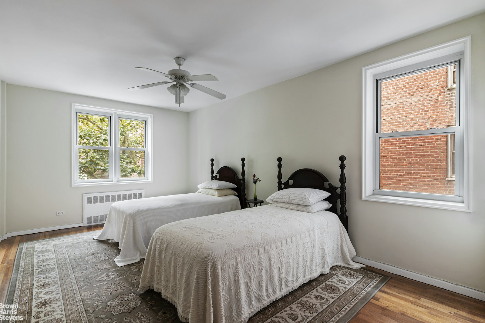 525 West 236th Street, Unit 2D Bronx, NY 10463 - Photo 7 of 9 a spacious bedroom with two beds and a window