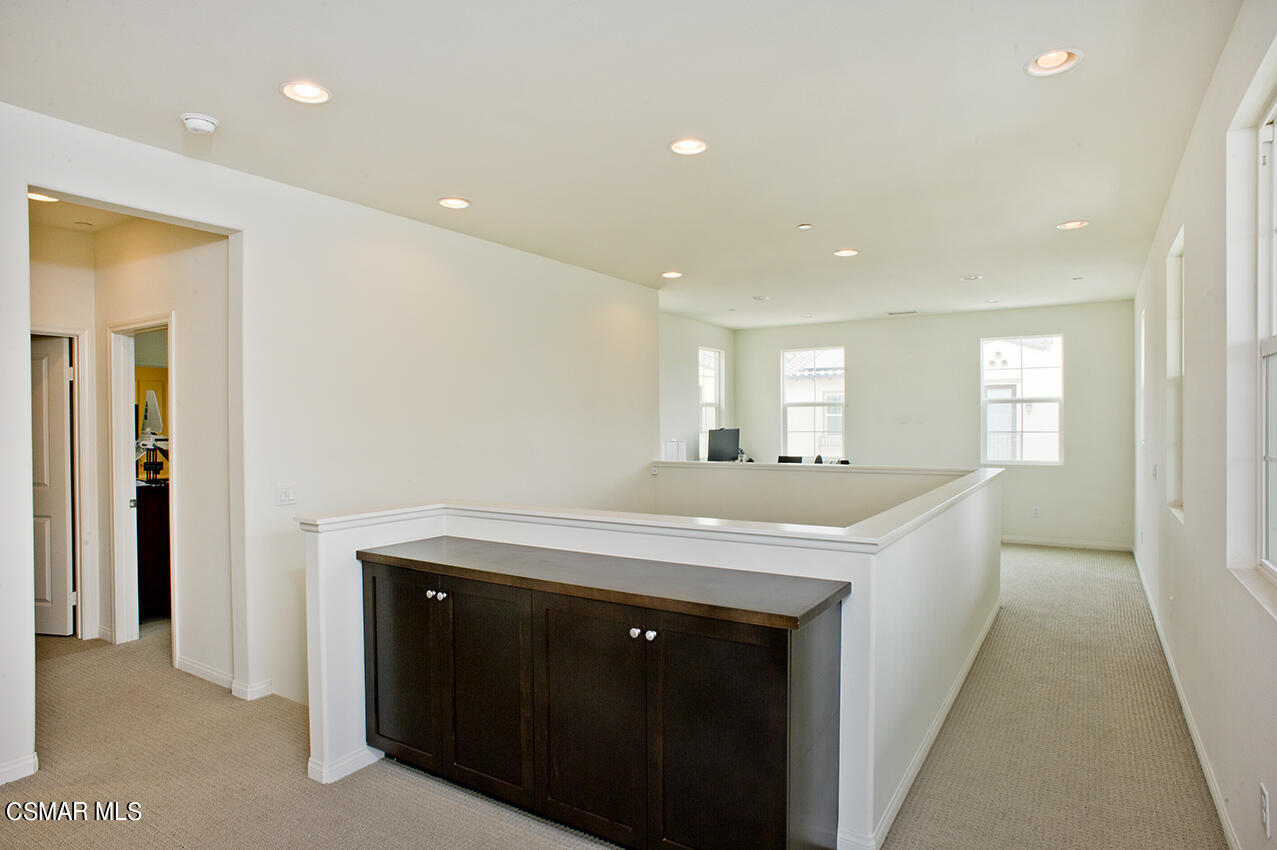 165 Stonegate Road Camarillo, CA 93010 - Photo 14 of 33 a kitchen with a sink and a mirror