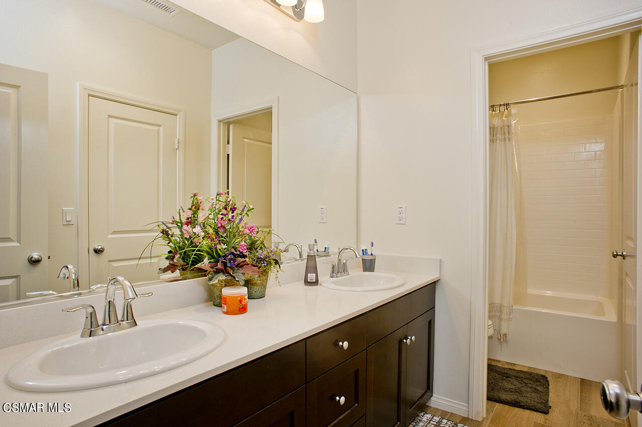 165 Stonegate Road Camarillo, CA 93010 - Photo 24 of 33 a bathroom with a sink and a mirror
