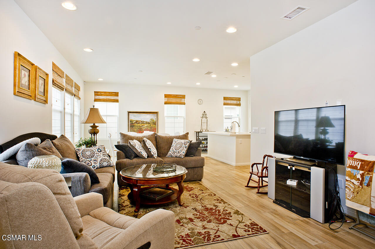165 Stonegate Road Camarillo, CA 93010 - Photo 5 of 33 a living room with furniture a flat screen tv and a fireplace