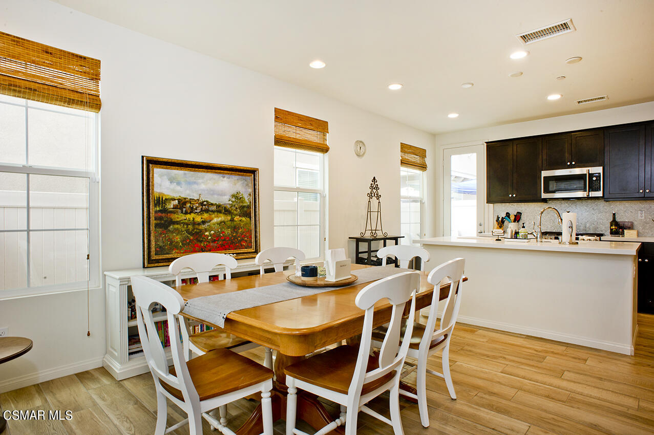 165 Stonegate Road Camarillo, CA 93010 - Photo 7 of 33 a dining room with furniture a flat screen tv and a large window