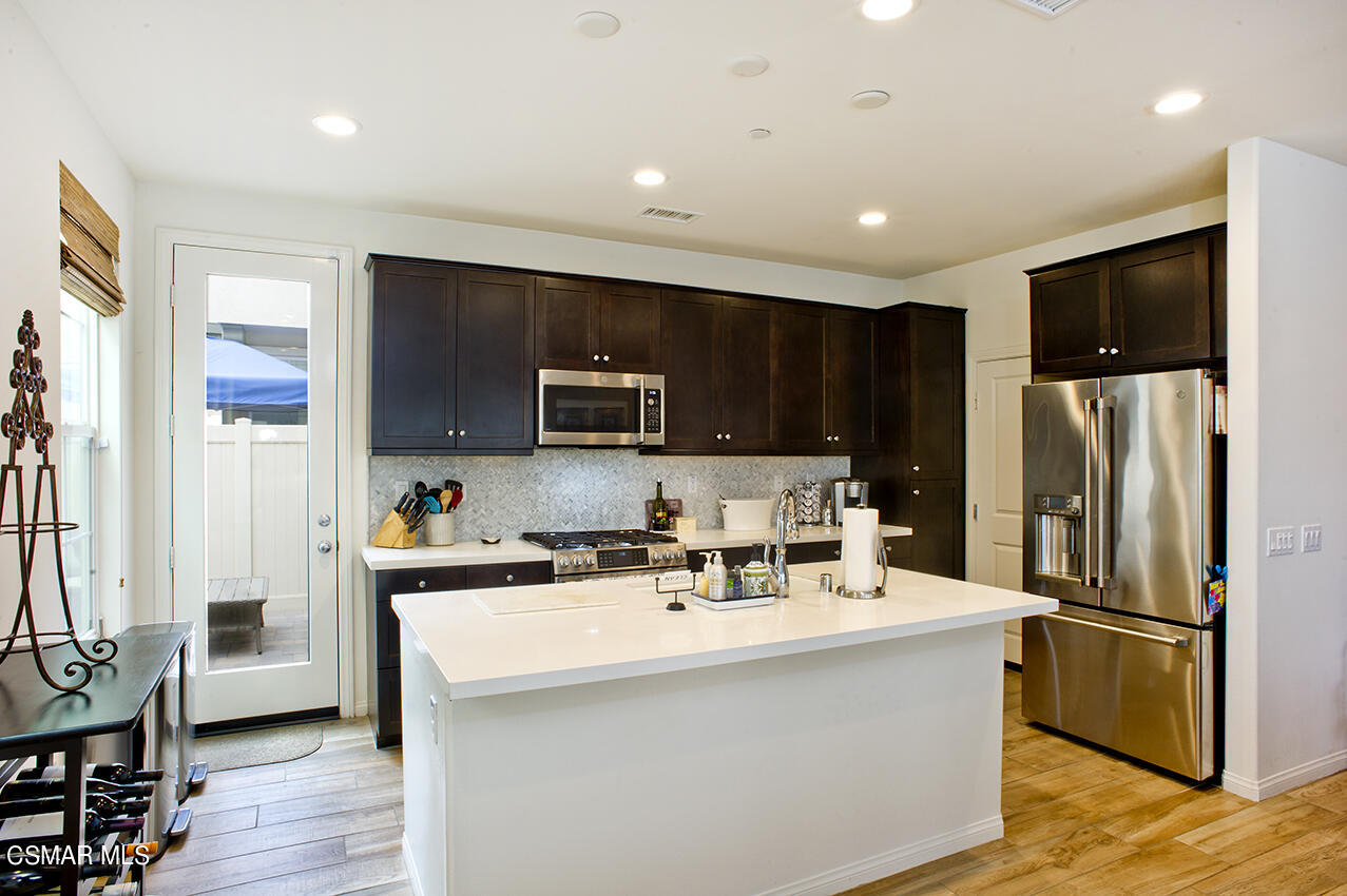 165 Stonegate Road Camarillo, CA 93010 - Photo 8 of 33 a kitchen with stainless steel appliances a refrigerator stove microwave and sink