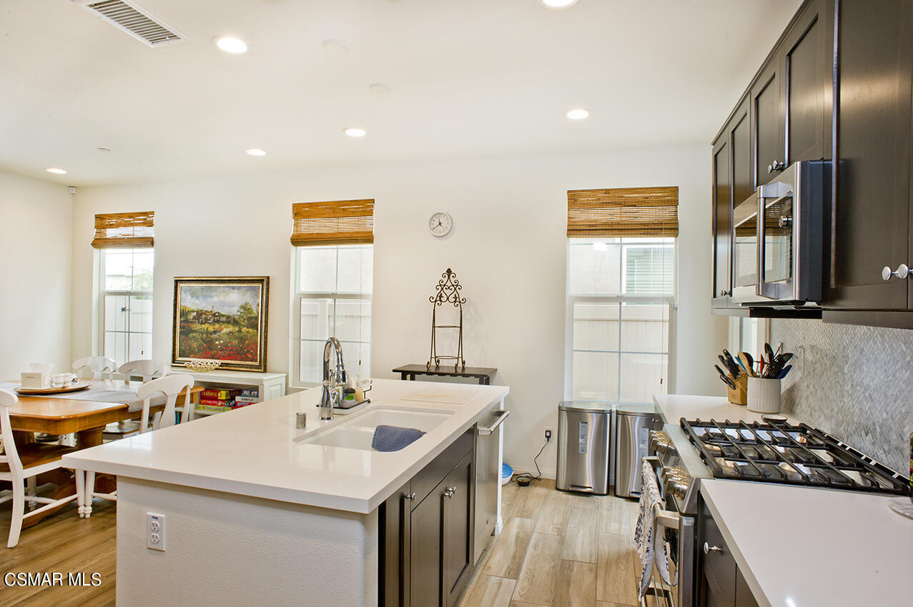 165 Stonegate Road Camarillo, CA 93010 - Photo 10 of 33 a kitchen with stainless steel appliances a sink stove and cabinets