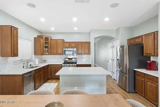 a bedroom with a bed and cabinets