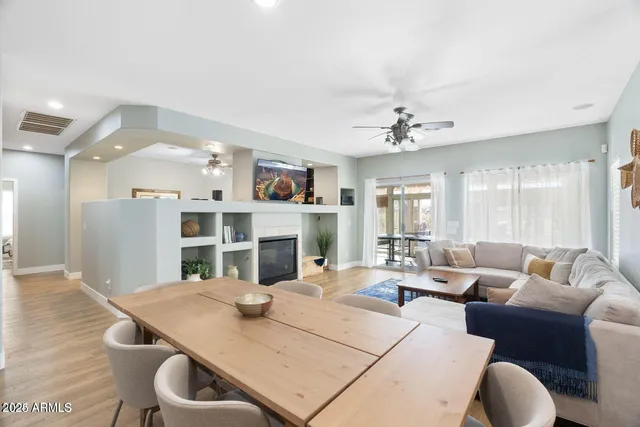 a living room with furniture and a fireplace