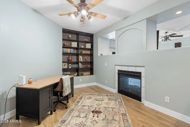 a bathroom with a double vanity sink mirror and refrigerator