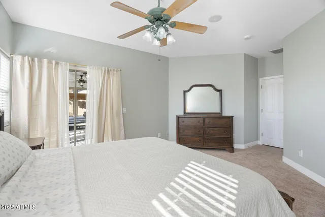 a spacious bathroom with a double vanity sink and a mirror