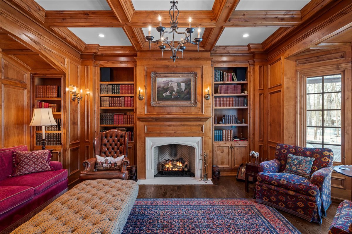 745 East Woodland Road Lake Forest, IL 60045 - Photo 13 of 77 a living room with furniture a rug and a fireplace