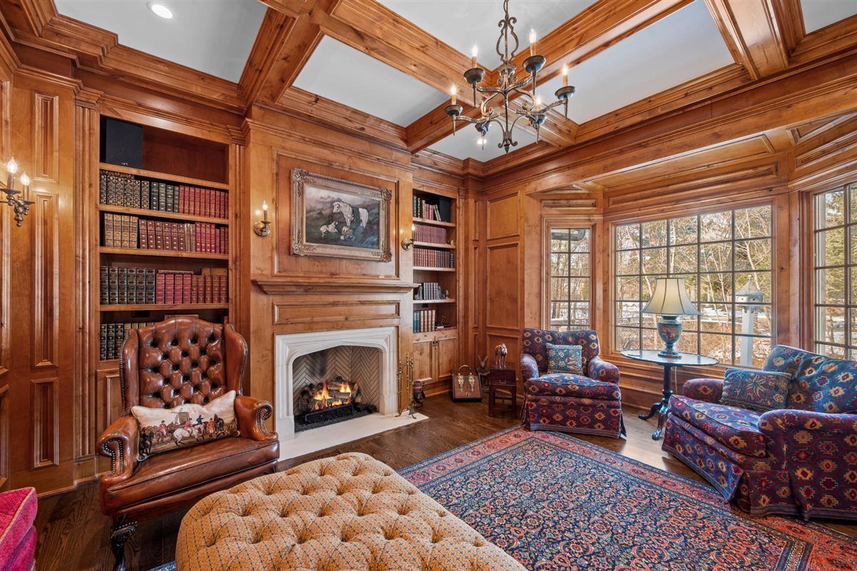 745 East Woodland Road Lake Forest, IL 60045 - Photo 14 of 77 a living room with furniture a rug and a fireplace