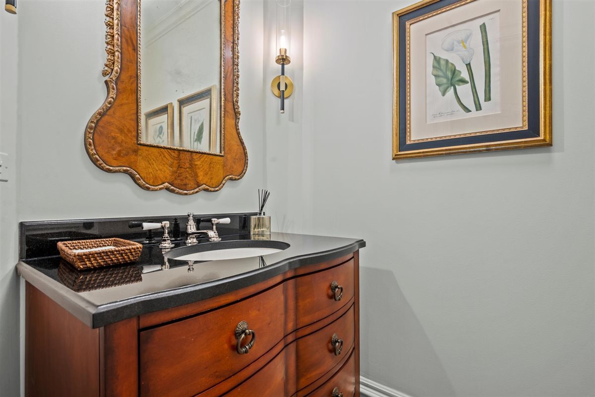 745 East Woodland Road Lake Forest, IL 60045 - Photo 16 of 77 a bathroom with a sink and a mirror