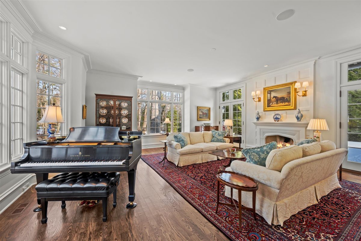 745 East Woodland Road Lake Forest, IL 60045 - Photo 17 of 77 a living room with furniture and a fireplace