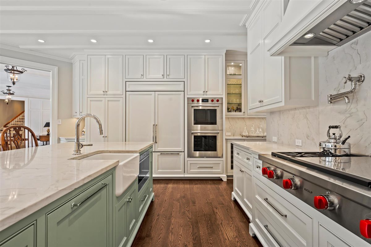 745 East Woodland Road Lake Forest, IL 60045 - Photo 22 of 77 a kitchen with stainless steel appliances granite countertop a sink stove and refrigerator