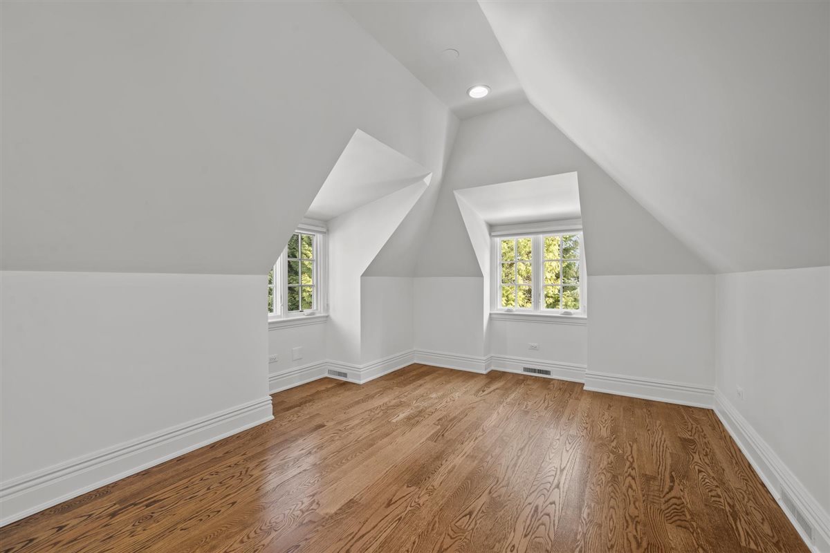 745 East Woodland Road Lake Forest, IL 60045 - Photo 45 of 77 an empty room with wooden floor and windows