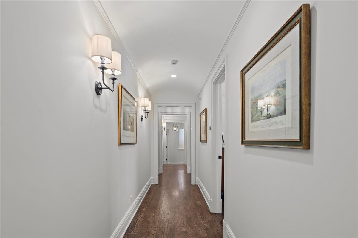 745 East Woodland Road Lake Forest, IL 60045 - Photo 49 of 77 a view of a hallway with wooden floor and closet