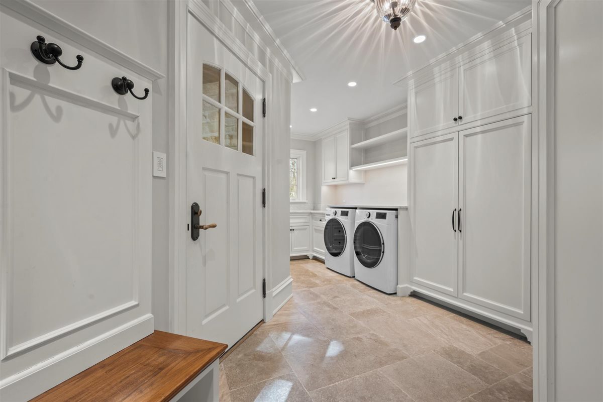745 East Woodland Road Lake Forest, IL 60045 - Photo 58 of 77 a view of a storage & utility room with washer and dryer