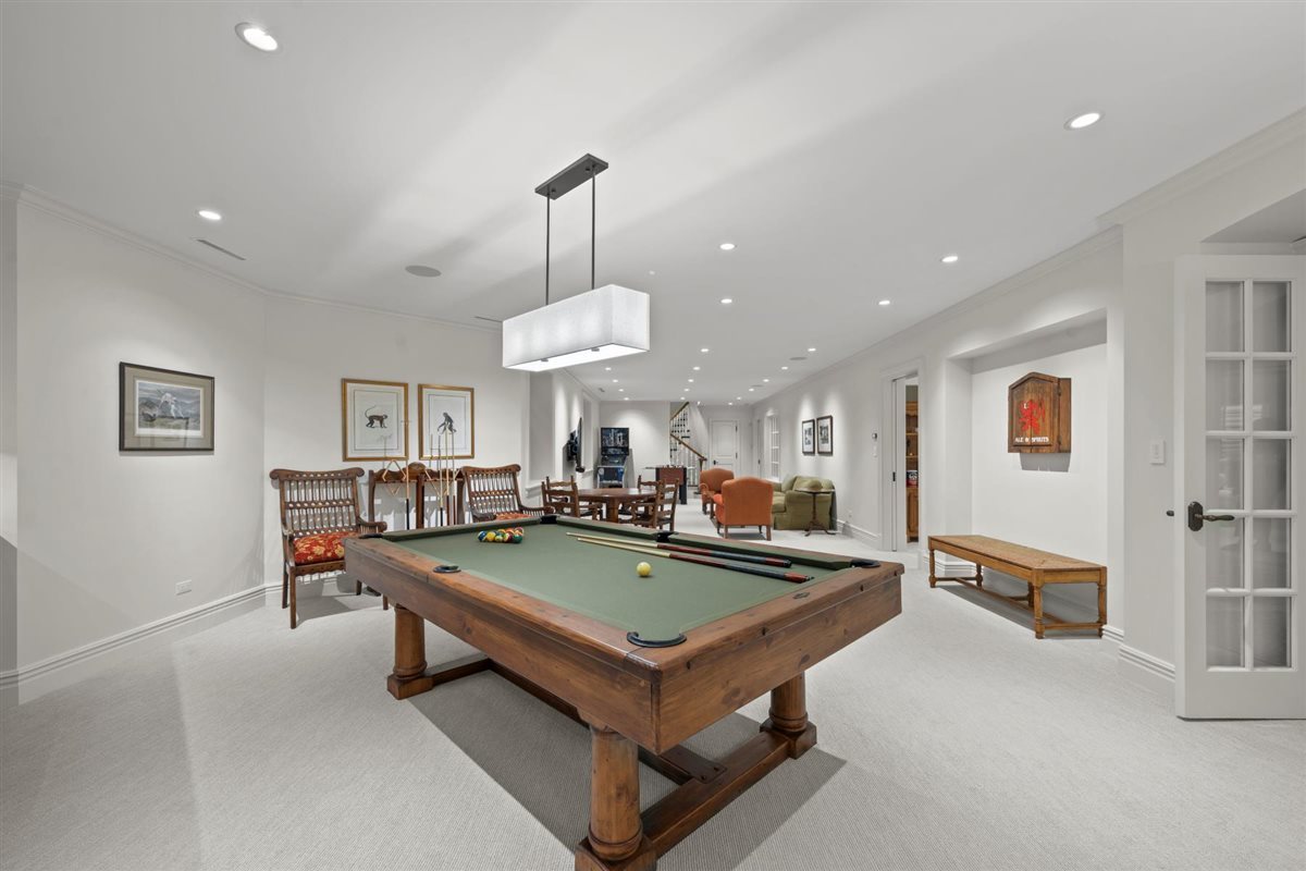 745 East Woodland Road Lake Forest, IL 60045 - Photo 61 of 77 a living room with furniture a table and a chandelier