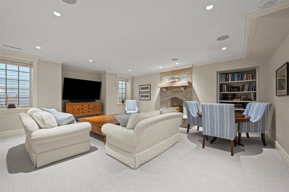 745 East Woodland Road Lake Forest, IL 60045 - Photo 64 of 77 a living room with furniture and a flat screen tv