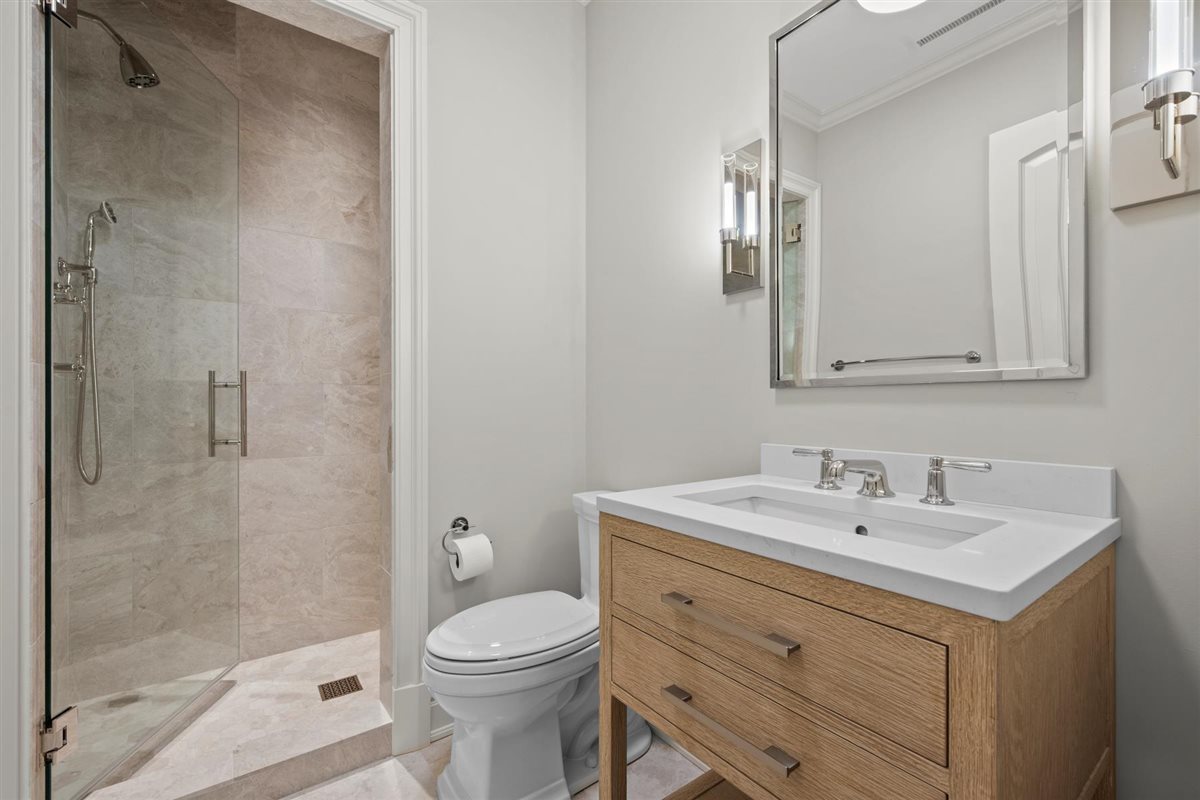 745 East Woodland Road Lake Forest, IL 60045 - Photo 67 of 77 a bathroom with a sink a toilet and shower