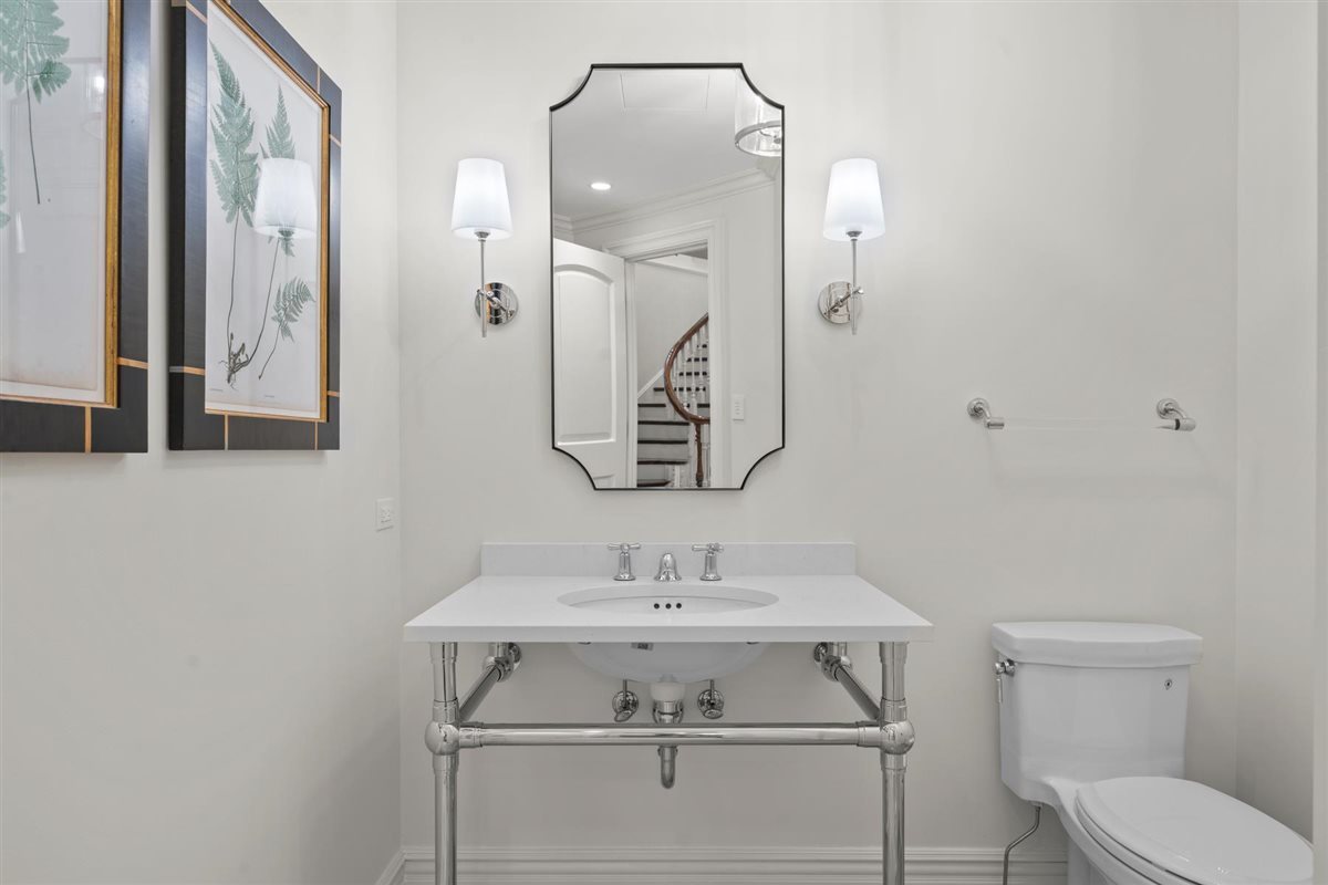 745 East Woodland Road Lake Forest, IL 60045 - Photo 68 of 77 a bathroom with a sink toilet and mirror