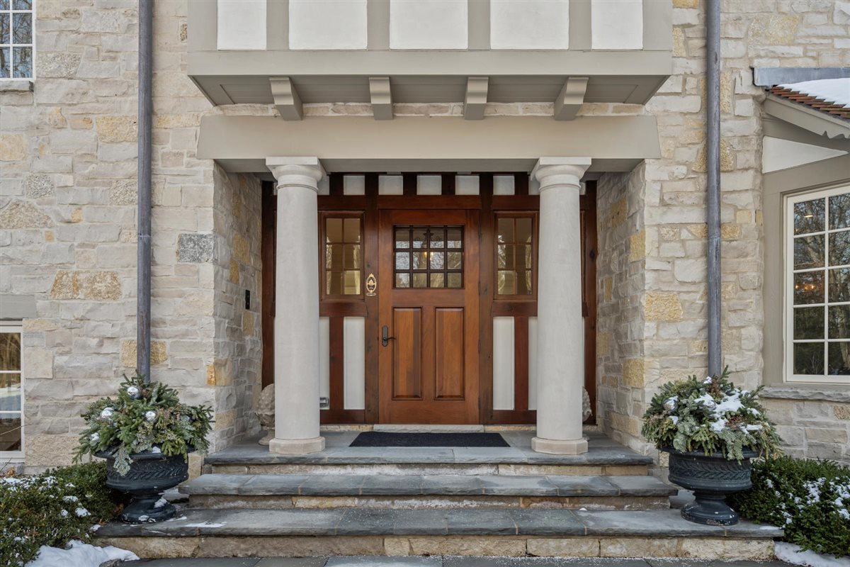 745 East Woodland Road Lake Forest, IL 60045 - Photo 8 of 77 a front view of a building with potted plants