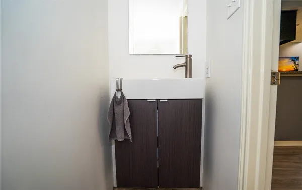 a bathroom with a sink and a mirror