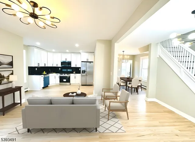 a living room with fireplace furniture and a dining table