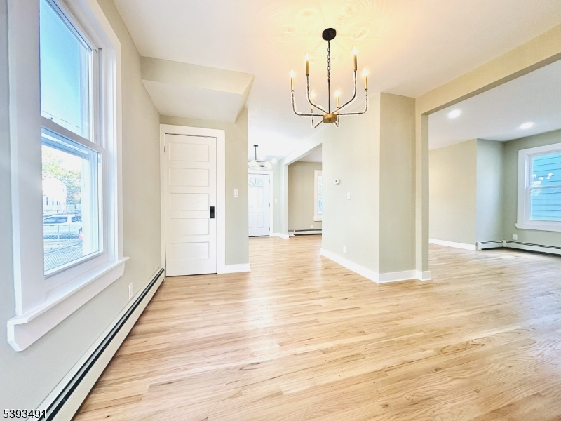 1222 West 3rd Street Plainfield, NJ 07063 - Photo 24 of 50 a view of a room with wooden floor and window