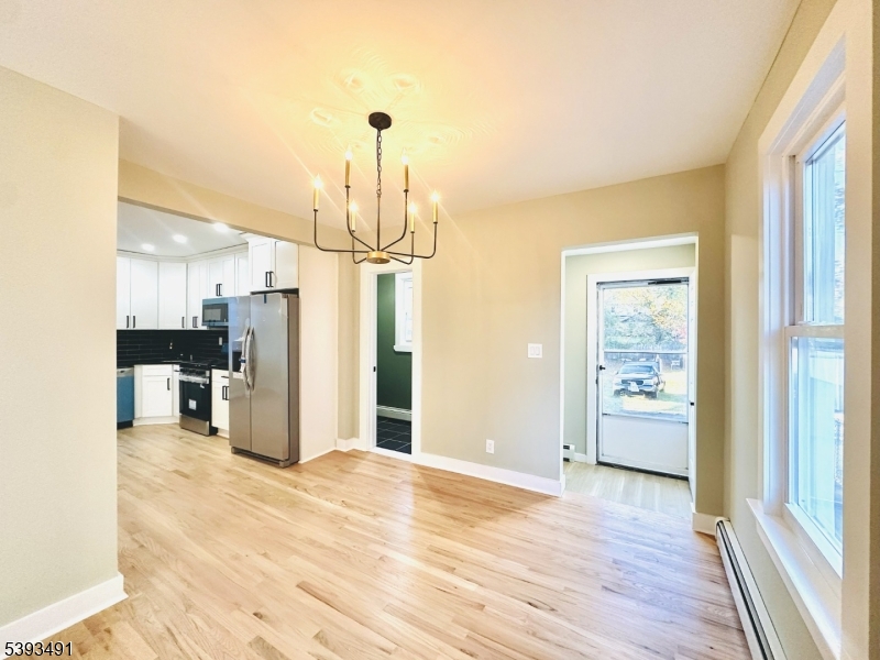1222 West 3rd Street Plainfield, NJ 07063 - Photo 25 of 50 a view of empty room with wooden floor and window
