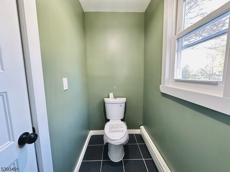 1222 West 3rd Street Plainfield, NJ 07063 - Photo 27 of 50 a bathroom with a toilet and a sink