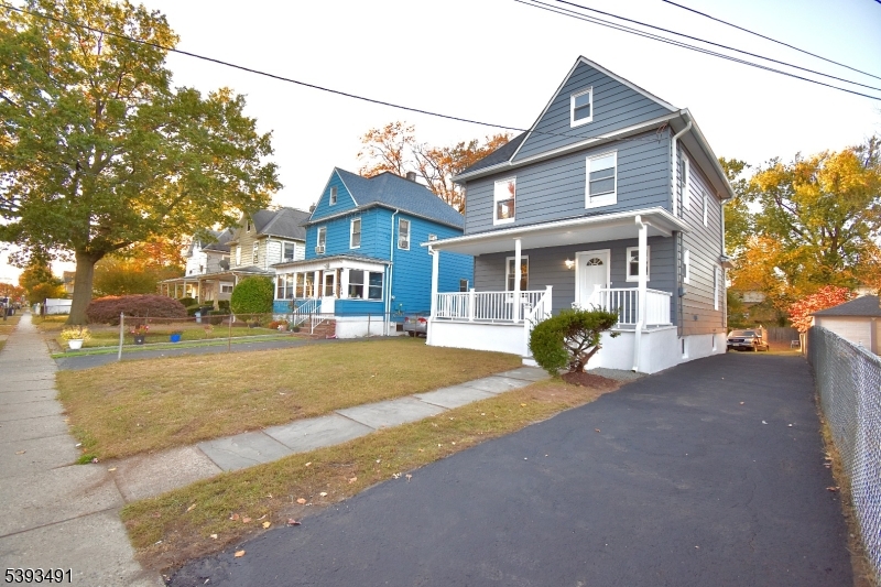 1222 West 3rd Street Plainfield, NJ 07063 - Photo 3 of 50 a view of a house with a yard